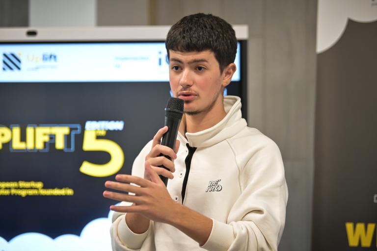 A young man speaking at a start-up conference