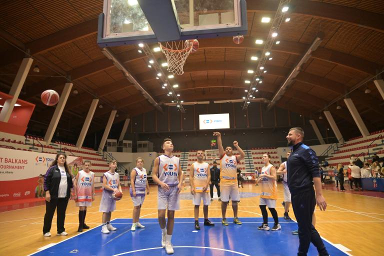 young people playing basketball